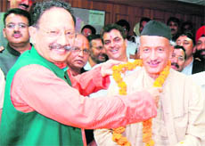 Chief Minister Maj Gen B.C. Khanduri (retd) garlands former Chief Minister Bhagat Singh Koshiyari after he filed his Rajya Sabha nomination papers at Dehradun on Monday.