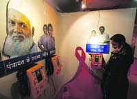 A girl listens to information on HIV/AIDS prevention being provided inside the Red Ribbon Express train at Jammu railway station on Monday. 