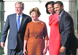 US President George W Bush and First Lady Laura Bush greet US President-elect Barack and Michelle Obama as they arrive at the White House in Washington DC