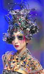 A model presents a creation for a cosmetic design contest at the China Fashion Week in Beijing