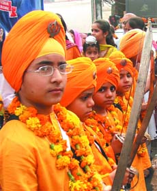 Sikh children participate in a religious procession at Sisgunj Gurdwara in New Delhi on the eve of 539th birth anniversary of Guru Nanak Dev