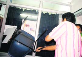 The office of the Career Launcher Institute on Subhash Road being ransacked by an ABVP activist on Wednesday. 