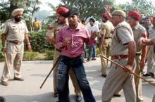 Cops try to control the situation on the Khalsa College campus where over 50 ABVP activists had a violent scuffle with the students.
