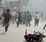 Cops try to control the situation on the Khalsa College campus where over 50 ABVP activists had a violent scuffle with the students.