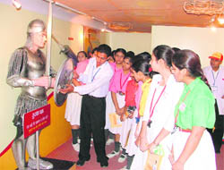 Students being given knowledge on protection cover on AID HIV in Red Ribbon Express in Ludhiana on Wednesday.