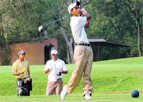 Rashid Khan drives on the 14th hole on the penultimate day of the LG Samarvir Sahi Golf Championship at the Chandigarh Golf Club