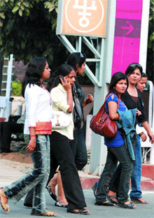 Girls seeking jobs in IITF arrive at Pragati Maidan in New Delhi on Thursday.