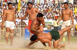 Players from India and Pakistan in action during their kabaddi final match at the sports stadium in Bathinda