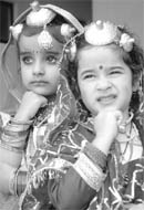 Little girls wait for their turn to perform on the occasion of the Childrens Day celebrations at Ryan International School in Patiala on Friday.