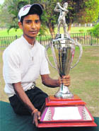 Rashid Khan with the LG Samarvir Sahi Golf Trophy at Chandigarh Golf Club on Friday.