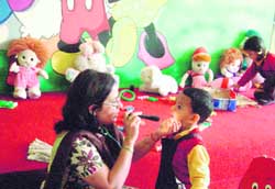 (Clockwise from top left) Tiny tots hold a fancy dress contest at Shemrock; one dresses up as a neta and another gets a dentall checkup Kids compete in a 50-metre race at the Uttarakhand Press Club.