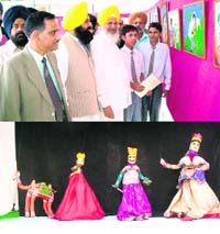 Cabinet minister Hira Singh Gabria watches visual arts exhibited at JNV Farour, and (below) a puppet show in progress
