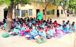 Students of Government Primary School attend classes on Children Day