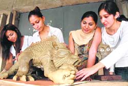 Participants try their hands at clay modelling. 