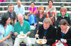 Food for verse: Participants at the poetry fest bond over a meal.