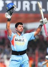 Yuvraj Singh celebrates his century at Rajkot. 