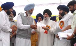 Cooperative Minister Capt Kanwaljit Singh giving away prizes to societies in Bathinda