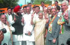 Chief Minister Sheila Dikshit with DPCC president Jai Prakash Agarwal and party candidates during a press conference at the DPCC office in New Delhi on Saturday.