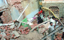 A woman died while one was injured when a building collapsed at Mem Gali, Chandni Chowk in New Delhi on Saturday.