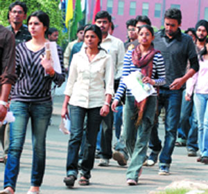 MBA aspirants come out after taking the CAT examination at Modern School in New Delhi on Sunday.