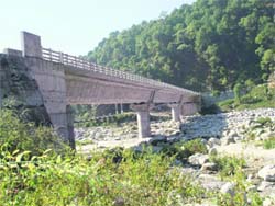 The bridge on the Neugal river that faces danger to its existence because of reckless mining.