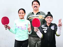 Winners Himani Bhatia and Jashandeep Singh with former international player Sanjeev Sood at the Ludhiana Table Tennis Championship.