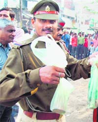 A police officer with evidences of a low intensity blast in which two minor girls where injured in the Aishbagh area in Lucknow