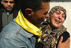 A relative of Palestinian militant Ahmed al-Helo mourns during his funeral in Gaza on Sunday.