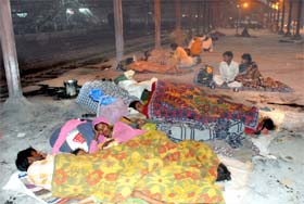 Homeless migrants sleep at the Bathinda railway station without a care in the world