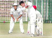 Nipun of PEC plays a shot agianst SGGS-26 during the Inter-College Cricket Tournament at the Sector 16 stadium on Monday. A Tribune photograph 