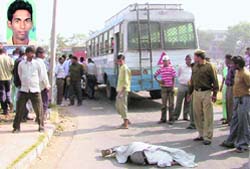 The body of Anil Singh (inset) lying near the bus in Panchkula