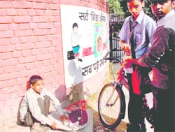 Sarv Shiksha Abhiyan may mandate education for all, but this little one is learning the lesson of life by selling fruits outside a school in Chandigarh