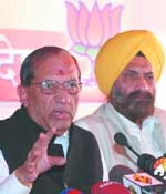V.K. Malhotra addresses a press conference in New Delhi on Monday.