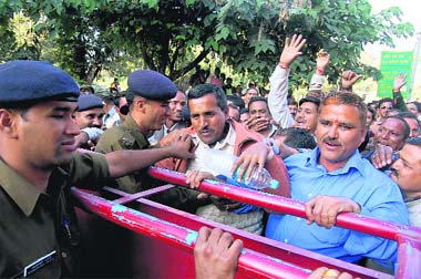 Uttarakhand forest guards protest outside the secretariat in Dehradun on Monday.