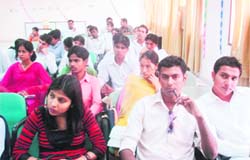Students of journalism and mass communication at Chaudhary Devi Lal University attend a seminar in Sirsa