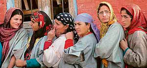 Women wait for their turn to cast their vote in Bandipora, 70 km from Srinagar, on Monday.