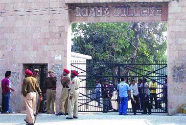 Cops stand guard outside Doaba College in Jalandhar on Monday. 
