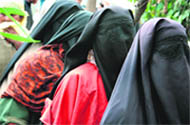 Kashmiri women await their turn at a Bandipora polling booth on Monday