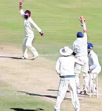 Off-spinner Sarandeep Singh of Himachal appeals for LBW against a Jammu and Kashmir batsman in the Ranji Trophy match at Dharamsala on Monday.