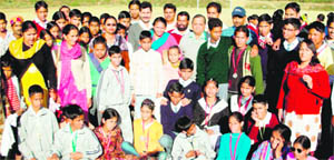 Disabled children with chief guest Arjuna Awardee Suman Rawat at Dharamsala on Tuesday.