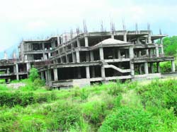 The half-completed hospital and medical college building of the VMRT at Palampur