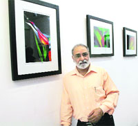 AP Singh, a photo artist, on the inaugural day of his exhibition at Artmosphere gallery in Ludhiana on Tuesday.