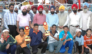 Boys and girls of the Talwandi Sabo zone, winners of the 54th district level annual meet organised by the education department, pose with their trophies in Bathinda on Wednesday.
