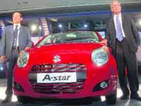 Maruti Suzuki India chairman R.C. Bhargava (R) and director, sales and marketing, S.Oishi pose with the newly unveiled 'A-Star' in New Delhi on Wednesday. 