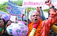 BJP candidate from New Delhi seat Vijay Jolly campaigns against the Congress-led Delhi government over water crisis outside Hanuman Mandir in New Delhi