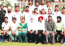 Players of GHG Khalsa College, Sadhar, pose after winning the Panjab University Hockey Championship held at Chandigarh.