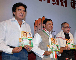(From left): Filmstar and Congress leader Raj Babbar, state Congress president Suresh Pachauri and external affairs minister Pranab Mukherjee release partys election manifesto in Bhopal 