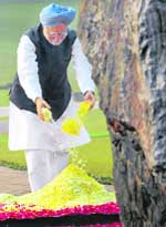 Prime Minister Manmohan Singh pays floral tirbute to former Prime Minister Indira Gandhi on her 91st birth anniversary at Shakti Sthal in New Delhi on Wednesday. 