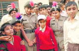 NCC cadets interact with visually impaired children at Institute for Blind in Chandigarh on Thursday.