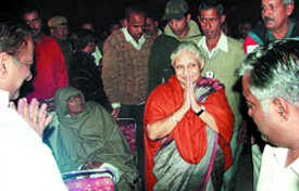 (Left) Chief Minister Sheila Dikshit campaigns in the New Delhi area. 